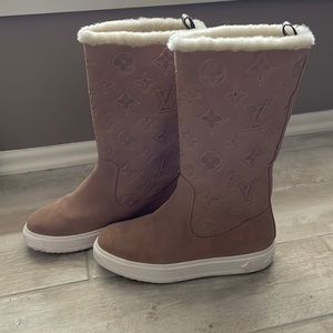 Louis Vuitton (faux) suede , lined winter boots. Never worn out of the house.